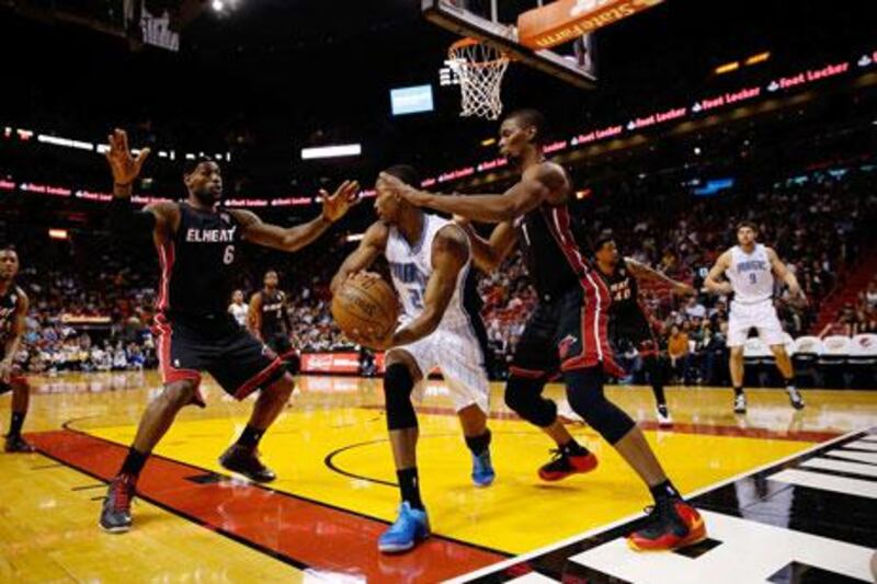 Chrish Bosh added 24 points to help Miami Heat prevail over the Indiana Pacers.