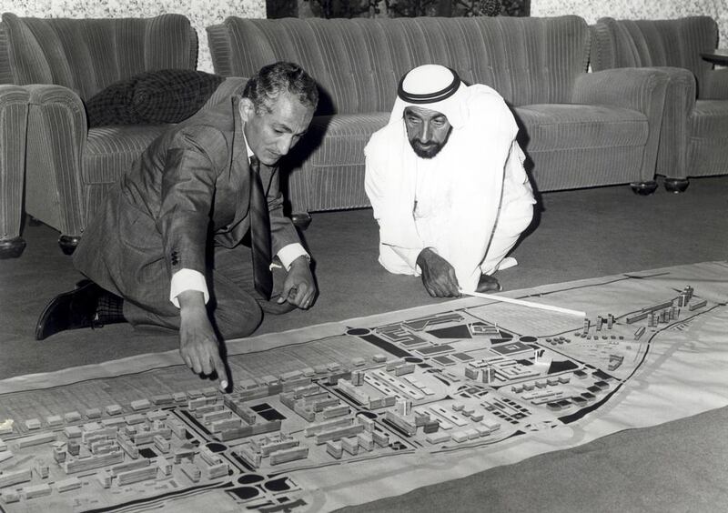 Dr Abdulrahman Makhlouf and Sheikh Zayed in 1974, planning how Abu Dhabi should look as it develops from a small coastal settlement into a fitting capital of the UAE. Photo: Courtesy National Centre for Documentation and Research