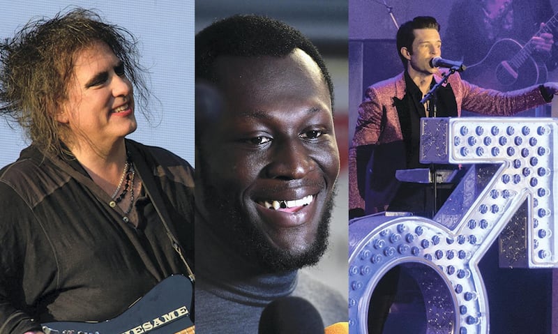 From left to right: Robert Smith of The Cure; Stormzy; and Brandon Flowers from The Killers. These are the three headline acts at Glastonbury 2019. PA Images