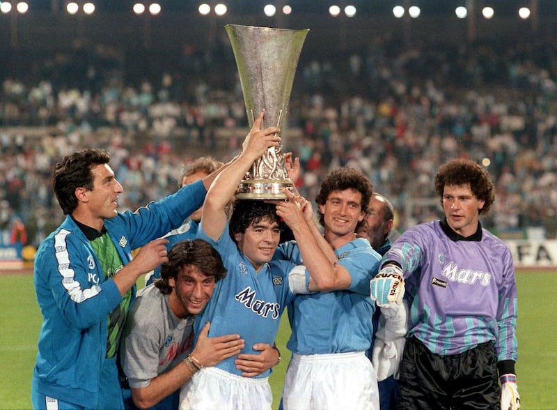 Raffaele Di Fusco,Massimo Crippa, Diego Armando Maradona, Francesco Romano and Giuliano Giuliani of SSC Napoli celebrate his victory with the trophy during the UEFA Cup Final Second Leg match between Stuttgart and Napoli, at Neckarstadion, Stuttgart, Germany on May 17th 1989  (Photo by Alessandro Sabattini/Getty Images)