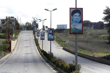 Hassan Nasrallah, depicted on posters along a road in Bint Jbeil, southern Lebanon, said Hezbollah had improved its air defence capabilities. Reuters