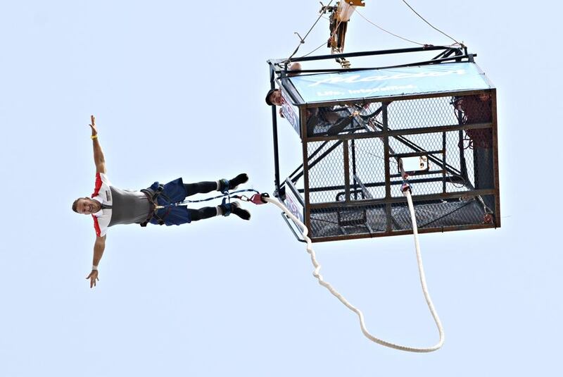 Colin Phillips begins his 106th bungee jump at Dubai Autodrome on Friday to seal his new world record. He went on to complete 151 jumps in 24 hours. Jeff Topping for The National 