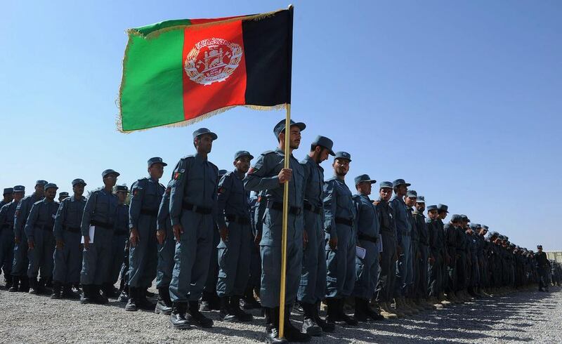 Members of the Afghan National Police attend a graduation ceremony at a police training centre in Herat. Aref Karimi / AFP Photo