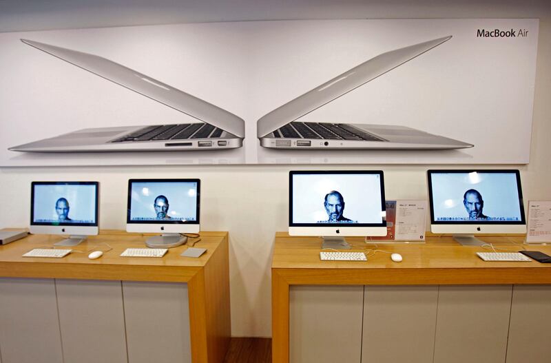 Portraits of the late Steve Jobs, co-founder of Apple Inc., illuminate computer monitors in an Apple retail store, in Taipei, Taiwan, Thursday, Oct. 6, 2011. Taiwanese rivals and partners of Apple Inc. lauded company founder Steve Jobs on Thursday, and news of his death dominated television coverage in the high-tech powerhouse. (AP Photo/Wally Santana) *** Local Caption ***  Taiwan Obit Jobs.JPEG-0edcd.jpg