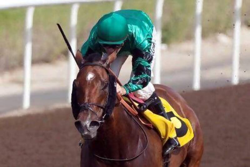 JEBEL ALI, United Arab Emirates, March 9 2012, JEBEL ALI Racecourse, Tenth Meeting, Race 2 - ESCAPE ROUTE ridden by Richard Mullen and trained by Satish Seemar charges to the wire at Jebel Ali Racecourse Race 2, March 9 2012. Mike Young / The National??