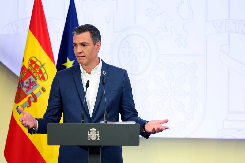 Spanish Prime Minister Pedro Sanchez made a point of not wearing a tie during a press conference in Madrid. AP