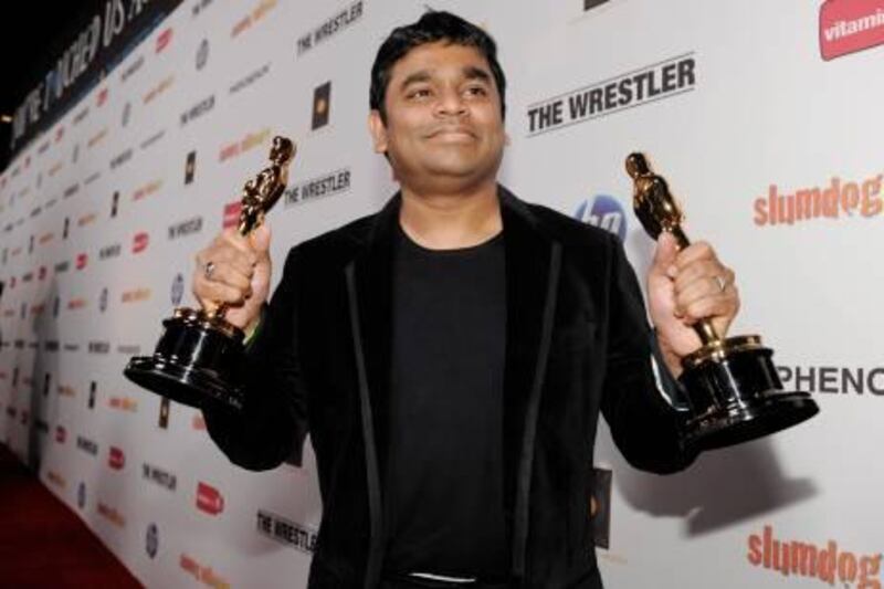 Indian composer AR Rahman holds his two Oscars for Best Original Song and Original Score for "Slumdog Millionaire" at the official Oscar After Party for Fox Searchlight's "Slumdog Millionaire" and "The Wrestler" in West Hollywood, Calif., Sunday, Feb. 22, 2009. (AP Photo/Chris Pizzello) *** Local Caption ***  CACP108_Slumdog_Millionaire_Post-Oscar_Party.jpg