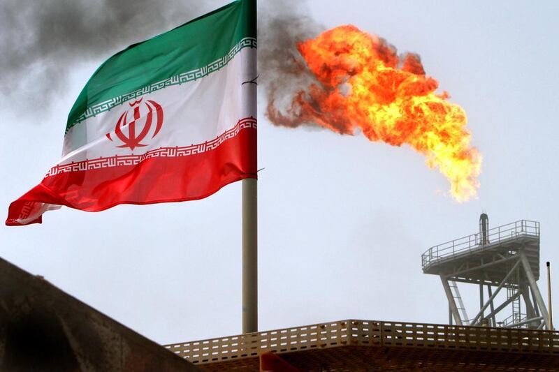 Above, gas flares from an oil production platform at the Soroush oilfields in Iran. Raheb Homavandi / Reuters