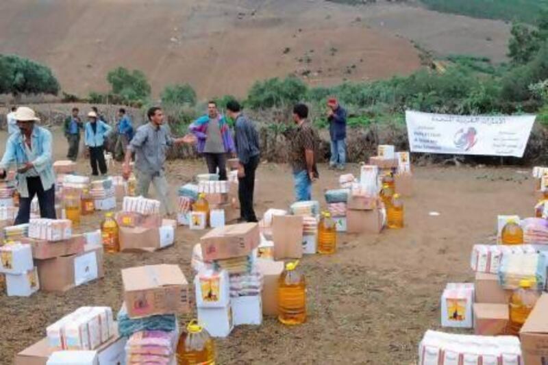 A team from the Khalifa bin Zayed Al Nahyan Foundation prepares aid parcels in Tunisia. Other projects include helping children return to school. Wam.