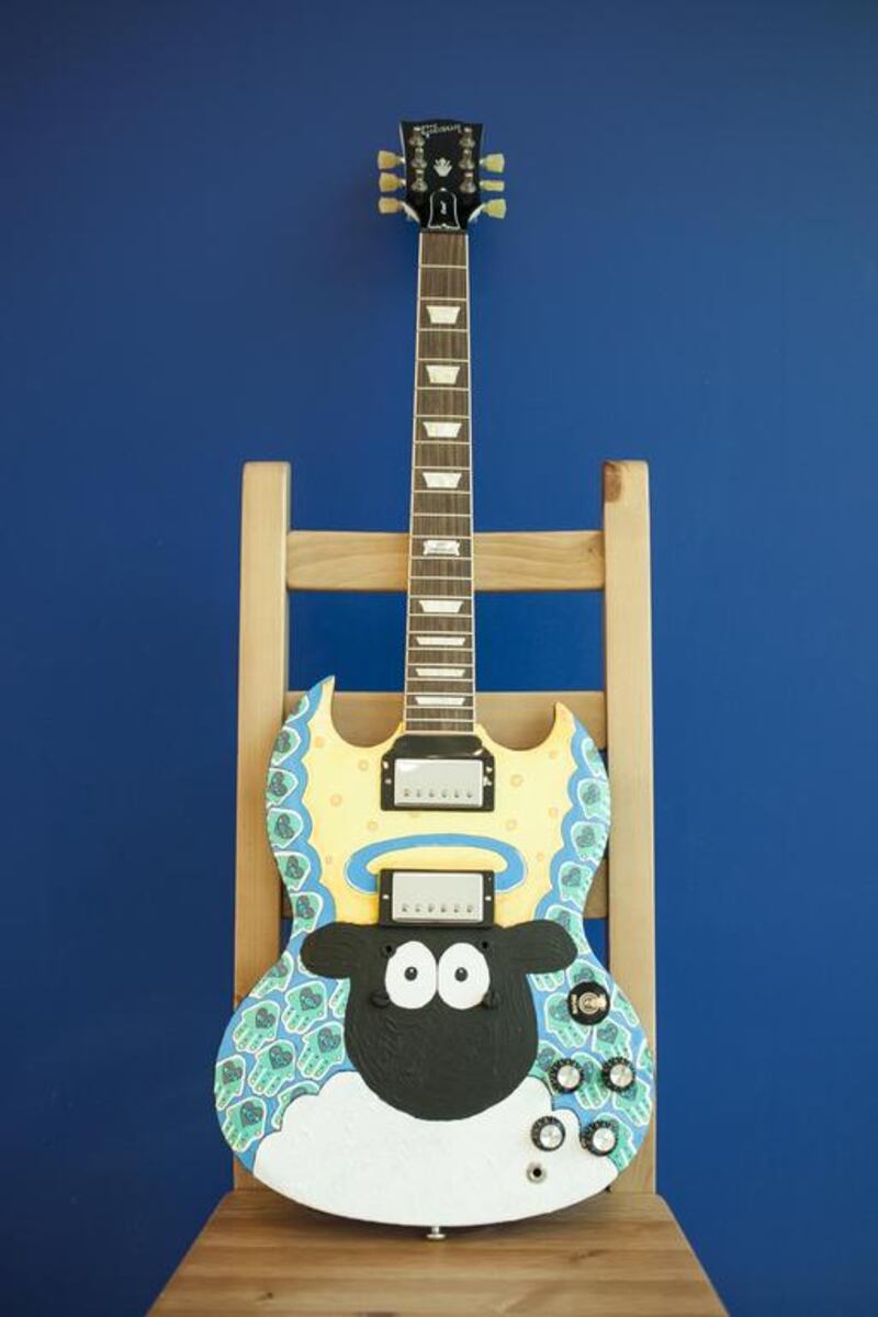 An SG Gibson guitar decorated by artist Dina Butti from Egypt titled The Hand Of The Halo. Antonie Robertson / The National