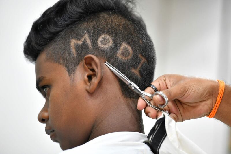 A young boy gets a Modi haircut. AFP