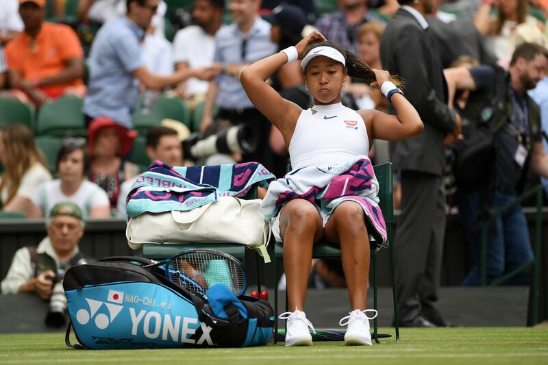 Naomi Osaka reacts as she sits down during a change of ends in her Ladies' Singles first round match against Yulia Putintseva of Kazakhstan during Day one of The Championships - Wimbledon 2019 at All England Lawn Tennis and Croquet Club on July 01, 2019 in London, England. Getty Images