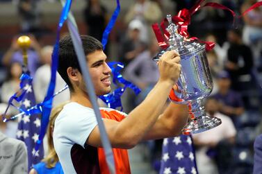 Sep 11, 2022; Flushing, NY, USA; Carlos Alcaraz (ESP) celebrates with the championship trophy after his match against Casper Ruud (NOR) (not pictured) in the men's singles final on day fourteen of the 2022 U. S.  Open tennis tournament at USTA Billie Jean King Tennis Center.  Mandatory Credit: Robert Deutsch-USA TODAY Sports