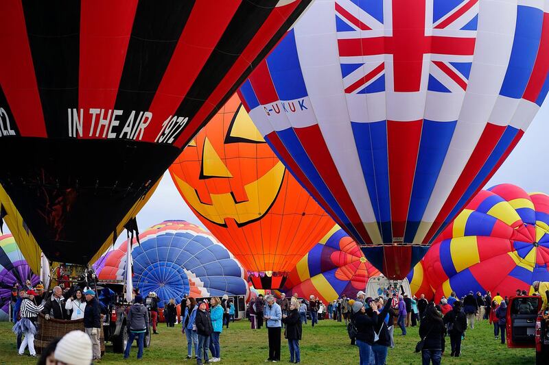 Hot air balloons prepare for launch during the Mass Ascension at Balloon Fiesta Park. AP Photo