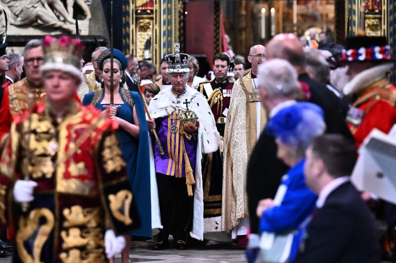 King Charles wearing the Imperial state Crown carrying the Sovereign's Orb and Sceptre leaves Westminster Abbey. AFP
