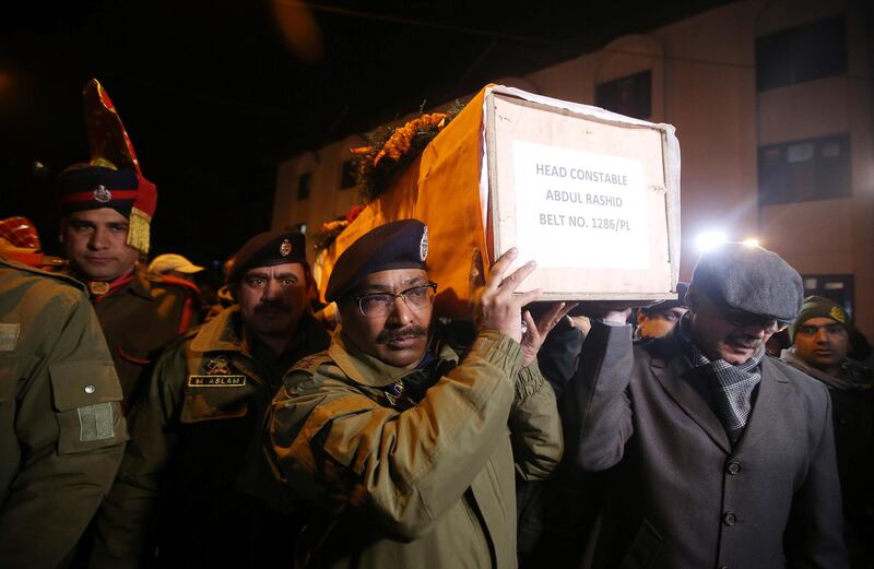 Indian police officers carry the coffin containing the body of their fallen colleague, who according to police was killed in a gun battle between suspected militants and security forces in south Kashmir’s Pulwama district, during his wreath-laying ceremony in Srinagar, February 18, 2019. REUTERS/Danish Ismail