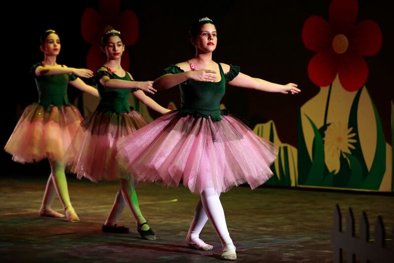 Dancers from the Baghdad Ballet Academy perform in a show entitled "The Four Realms" at Al-Rasheed theatre in Baghdad, on February 24, 2023.  (Photo by AHMAD AL-RUBAYE  /  AFP)