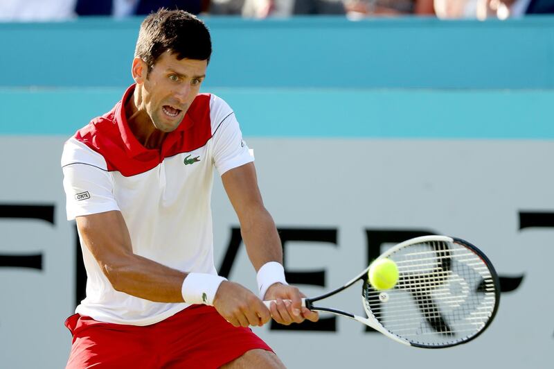LONDON, ENGLAND - JUNE 21:  Novak Djokovic of Serbia returns a shot during his men's singles match against Grigor Dimitrov of Bulgaria during Day Four of the Fever-Tree Championships at Queens Club on June 21, 2018 in London, United Kingdom.  (Photo by Matthew Stockman/Getty Images)