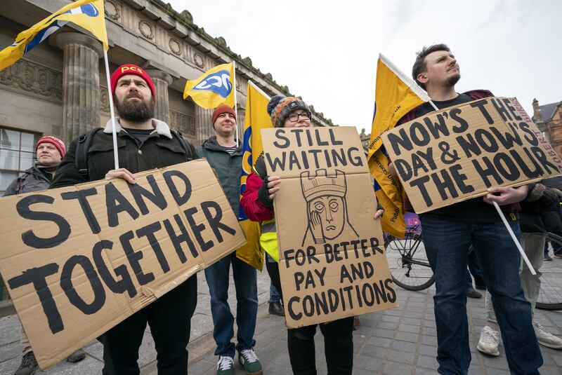 Members of the Public and Commercial Services Union and and University and College Union gather at the Mound in Scotland's capital Edinburgh. PA