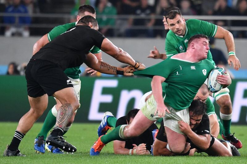 Ireland's prop Tadhg Furlong (R) is tackled during the Japan 2019 Rugby World Cup quarter-final match between New Zealand and Ireland at the Tokyo Stadium in Tokyo. AFP