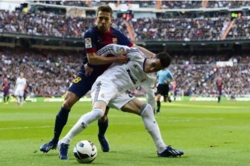 Jordi Alba, left, and his Barcelona teammates will once again battle with Real Madrid and Jose Maria Callejon.