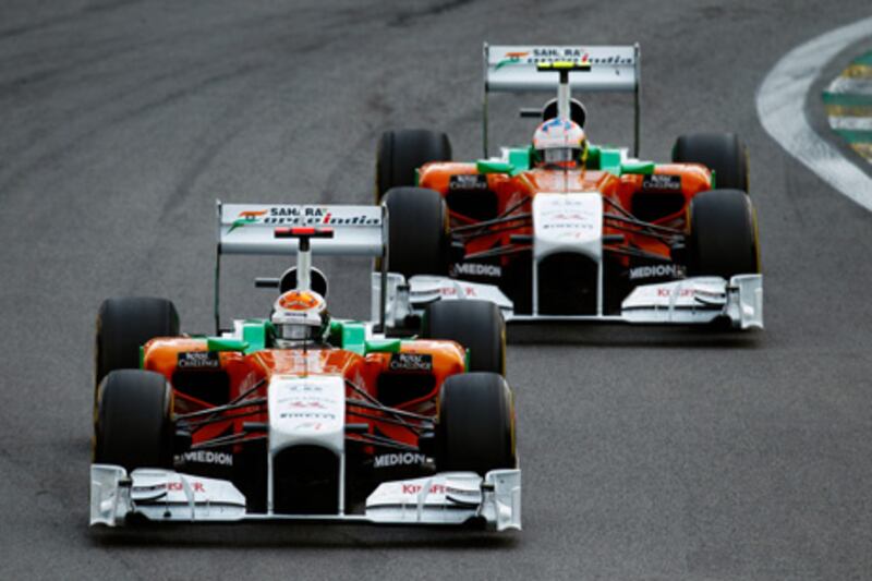 SAO PAULO, BRAZIL - NOVEMBER 27:  Adrian Sutil of Germany and Force India leads from team mate Paul di Resta of Great Britain and Force India during the Brazilian Formula One Grand Prix at the Autodromo Jose Carlos Pace on November 27, 2011 in Sao Paulo, Brazil.  (Photo by Paul Gilham/Getty Images)