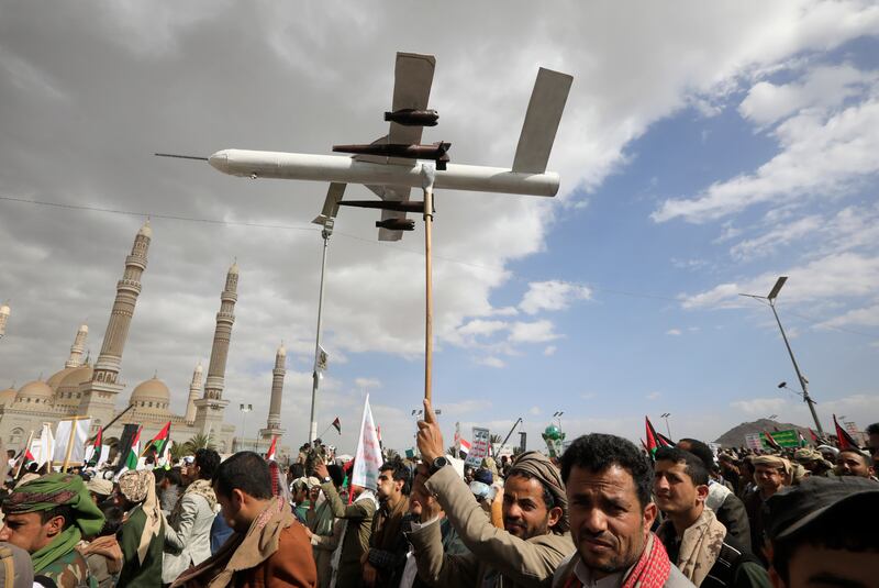 A Houthi supporter holds up a mock drone during a protest against the US and Israel in Sanaa, Yemen. EPA