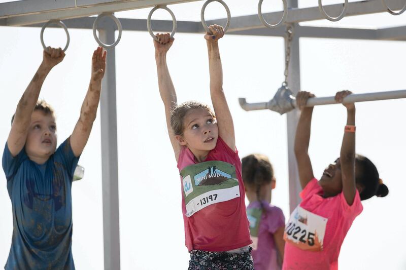 DUBAI, UNITED ARAB EMIRATES - DECEMBER 7, 2018. 

Children participate in the mini Tough Mudder challenge in Hamdan Sports Complex.

du Tough Mudder is a mud and obstacle course designed to test participant's physical strength, stamina, and mental grit. It is a team-oriented challenge with no winners, finisher medals, or clocks to race against. 

(Photo by Reem Mohammed/The National)

Reporter:
Section:  NA