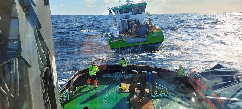 Norwegian Rescue Services look at the AQS, a boat which was being transported on board Eemslift Hendrika, and was drifting at sea after falling off. AFP