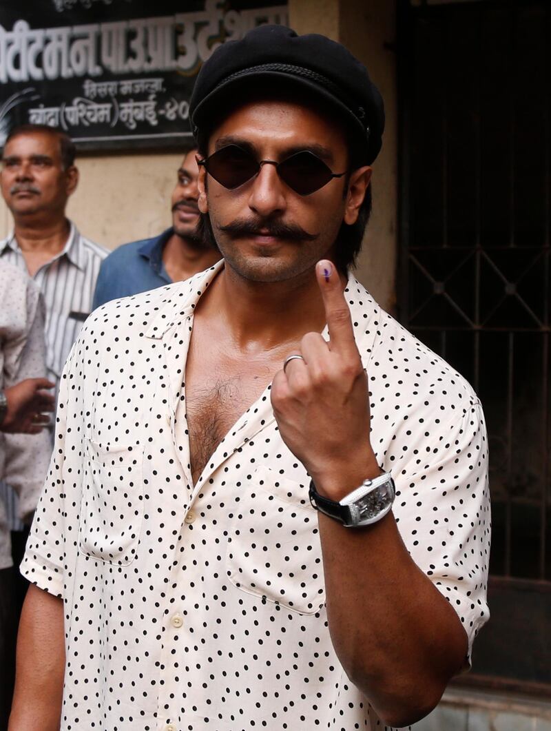 Bollywood actor Ranveer Singh shows the ink mark on his index finger after casting his vote outside a polling station in Mumbai, Monday, Oct. 21, 2019. Polling is being held to elect Indian states of Maharashtra and Haryana assemblies with the ruling Bharatiya Janata Party and its allies seeking to retain power in the two states on the back of the recent general elections victory. AP / Rafiq Maqbool