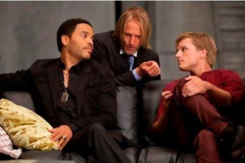 From left, Lenny Kravitz, Woody Harrelson and Josh Hutcherson in The Hunger Games.