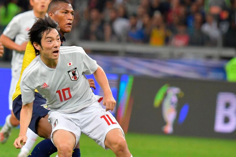 Japan's Shoya Nakajima celebrates after scoring against Ecuador. AFP