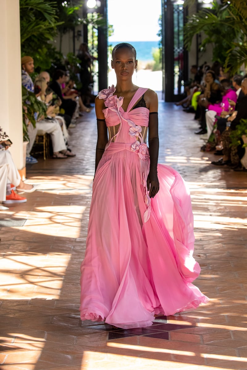 A pastel pink gown was adorned with handmade flowers