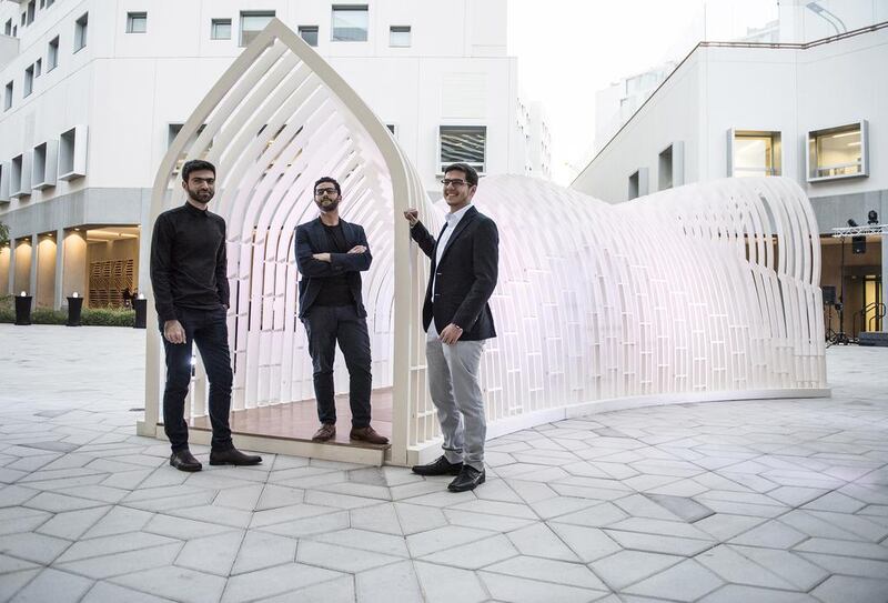 From left, Khalid Al Tamimi, Ghanem Younes and Mohammad Abu Al Huda, who won the Christo and Jeanne-Claude Award with their sculpture, The Silk Road, inspired by Islamic architecture. Vidhyaa for The National
