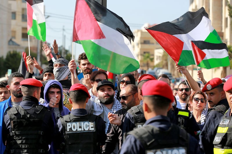Jordanians protest outside the Israeli embassy in Amman following an Israeli air strike which ripped through a Gaza hospital, killing hundreds. AFP