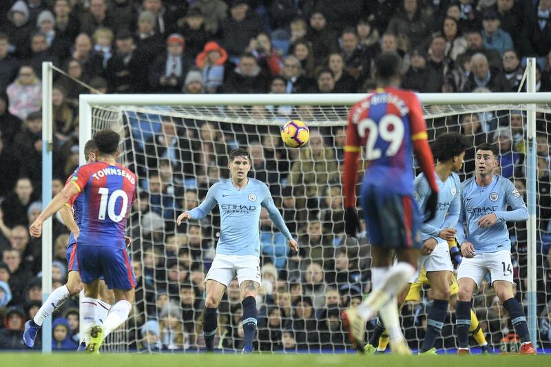 Crystal Palace's English midfielder Andros Townsend (L) strikes the ball to score their second goal to take the lead 1-2 during the English Premier League football match between Manchester City and Crystal Palace at the Etihad Stadium in Manchester, north west England, on December 22, 2018. (Photo by Oli SCARFF / AFP) / RESTRICTED TO EDITORIAL USE. No use with unauthorized audio, video, data, fixture lists, club/league logos or 'live' services. Online in-match use limited to 120 images. An additional 40 images may be used in extra time. No video emulation. Social media in-match use limited to 120 images. An additional 40 images may be used in extra time. No use in betting publications, games or single club/league/player publications. / 