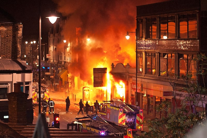 Buildings burn on London's Tottenham High Road.