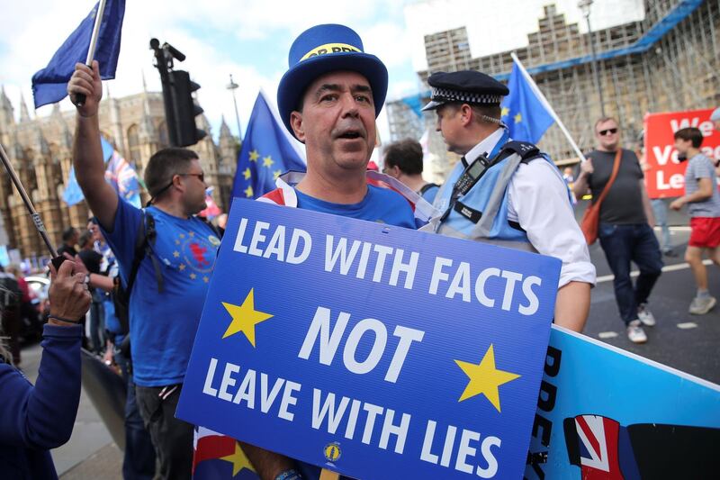 Anti-Brexit activist  demonstrates outside the Houses of Parliament. AFP