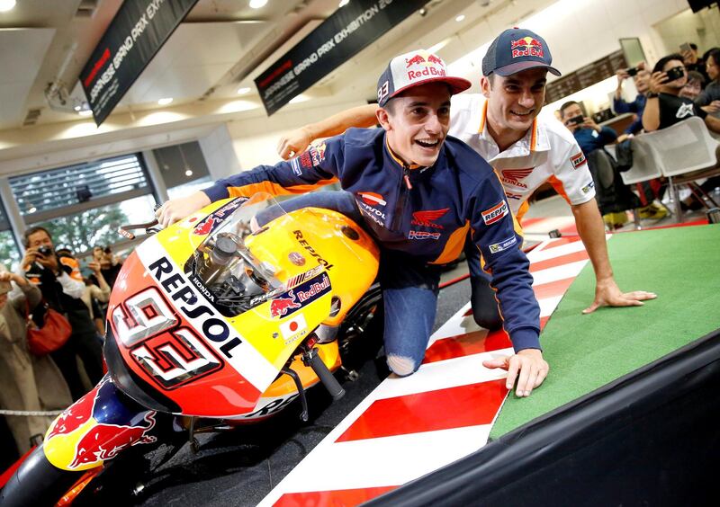 Repsol Honda Team's Marc Marquez and  Dani Pedrosa pose for a photograph during a fan event in Tokyo, Japan. Reuters