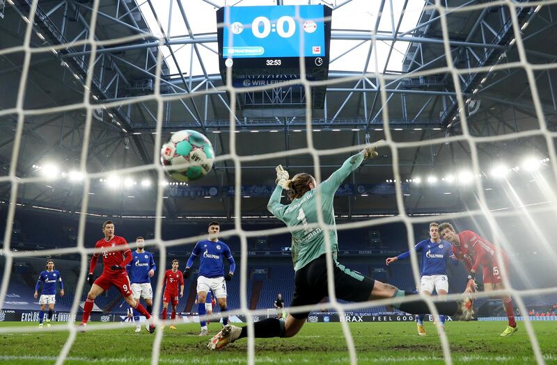 Thomas Muller finishes past Schalke goalkeeper Ralf Fahrmann to open the scoring. EPA