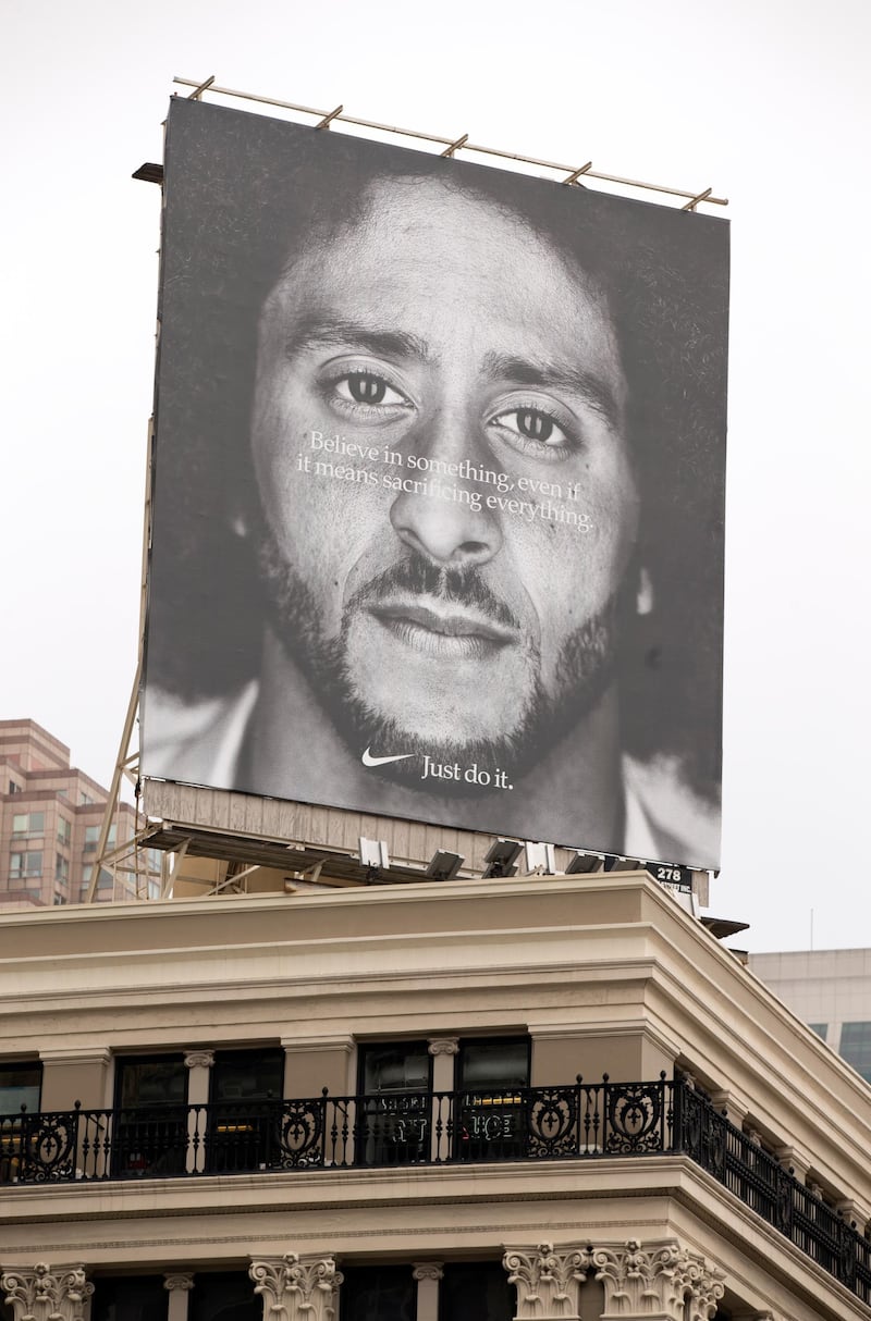 epa06999826 A Nike billboard featuring an image of NFL quarterback Colin Kaepernick is seen near Union Square in San Francisco, California, USA, 05 September 2018. Nike announced Kaepernick as the face of its new 'Just Do It' ad campaign which has led to public reaction in both directions and an initial impact on the company's stock value.  EPA/D. ROSS CAMERON