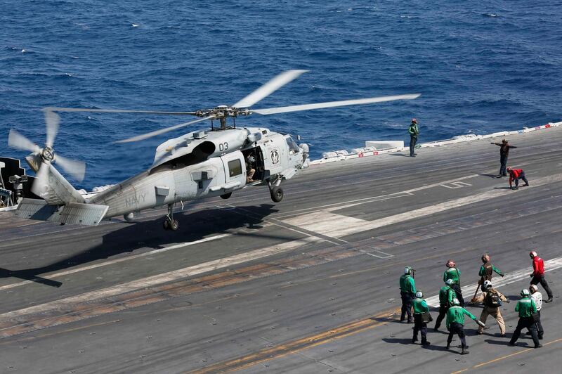 A handout photo made available by the US Navy shows an MH-60R Sea Hawk helicopter from the 'Griffins' of Helicopter Maritime Strike Squadron (HSM) 79 lands on the flight deck of the Nimitz-class aircraft carrier USS Abraham Lincoln (CVN 72), in the Arabian Sea. The Abraham Lincoln Carrier Strike Group (CSG) 12 is deployed in the region amid heightened tensions between the US and Iran, with both saying they don't seek war.  EPA