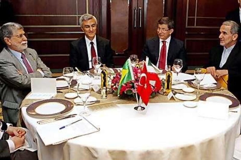(From left) Brazil's Foreign Minister Celso Amorim, Turkish deputy secretary Engin Soysal, Turkey's Foreign Minister Ahmet Davutoglu and Iranian deputy secretary Mehdi Akhoundzadeh pose before their meeting in Istanbul.