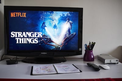 A television monitor displays the home screen for the Netflix Inc. original series 'Stranger Things' in an arranged photograph taken in the Brooklyn Borough of New York, U.S., on Thursday, April 12, 2018. Netflix Inc. is scheduled to release earnings on April 16. Photographer: Gabby Jones/Bloomberg