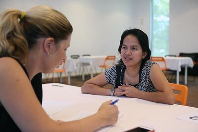 A potential sponsor interviews a housemaid during a speed-recruiting event in Abu Dhabi. Satish Kumar / The National