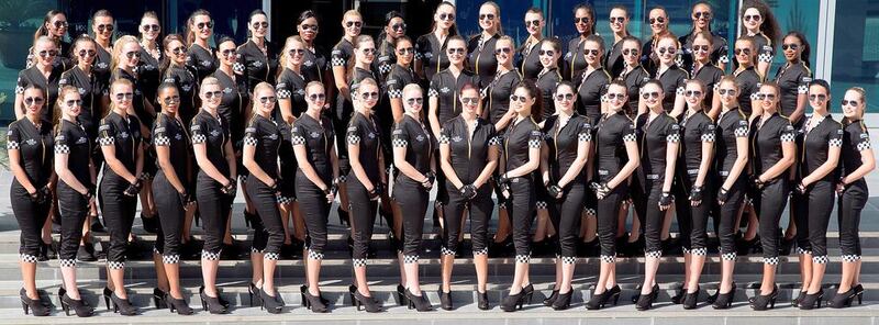 Etihad Airways “grid girls” gather ahead of Sunday’s Formula One Etihad Airways Abu Dhabi Grand Prix. The cabin crew – dressed in iconic Formula 1 uniforms – have become a key feature of the Yas Marina Circuit race. Courtesy Etihad Airways