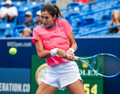 epa06951755 Garbine Muguruza of Spain in action against Lesia Tsurenko of Ukraine in their match in the Western & Southern Open tennis tournament at the Lindner Family Tennis Center in Mason, Ohio, USA, 15 August 2018.  EPA/TANNEN MAURY