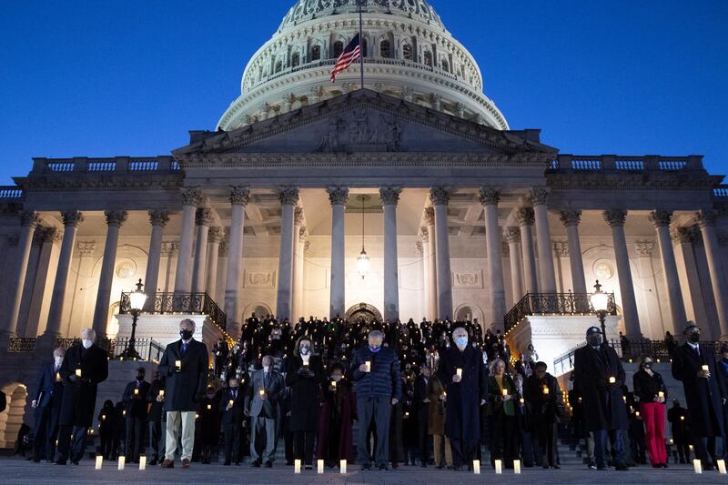 From left: House Majority Leader Steny Hoyer, House Minority Leader Kevin McCarthy, US Speaker of the House Nancy Pelosi, Senate Majority Leader Chuck Schumer, Senate Minority Leader Mitch McConnell, with members of Congress observe a moment of silence during an event held at Capitol Hill to honour the 500,000 people in the US who have died from Covid-19.