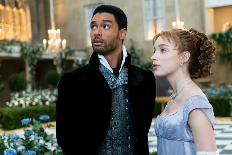 Phoebe Dynevor and Rege-Jean Page in a scene from 'Bridgerton', nominated for an Emmy Award for Outstanding Drama Series. Netflix via AP