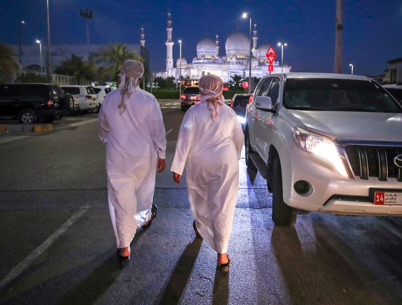 Worshippers leave Ibn Taymiyyah Mosque in Abu Dhabi, close to the Sheikh Zayed Grand Mosque, after evening prayers on the day the death of President Sheikh Khalifa was announced. Victor Besa / The National.